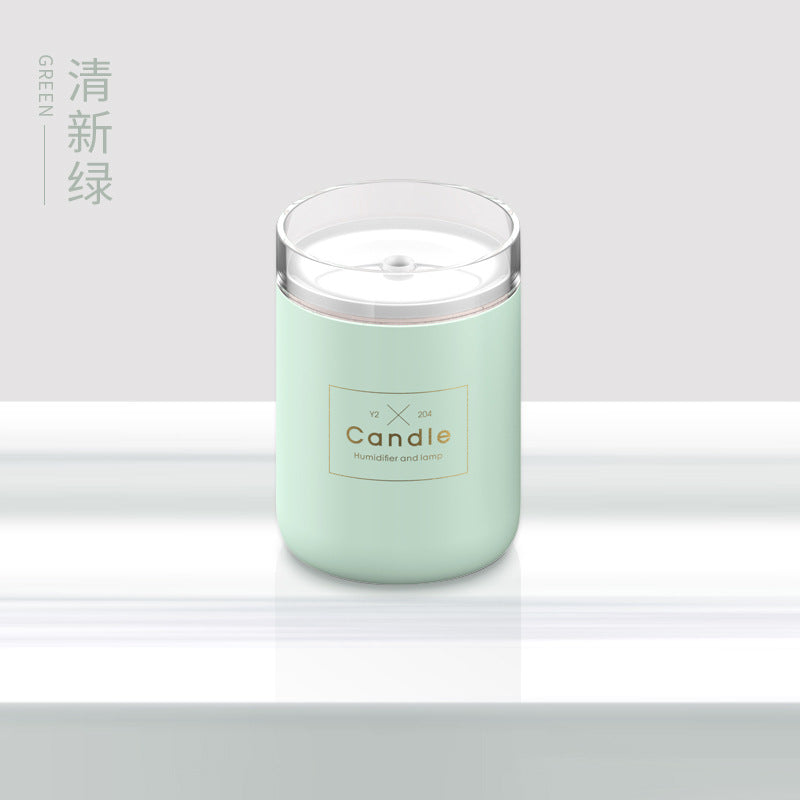 Mint green candle-style aroma diffuser jar with clear top and label