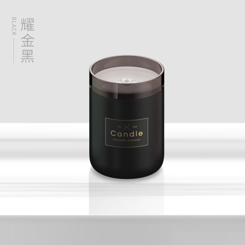Black candle-style aroma diffuser jar with clear top and centered label