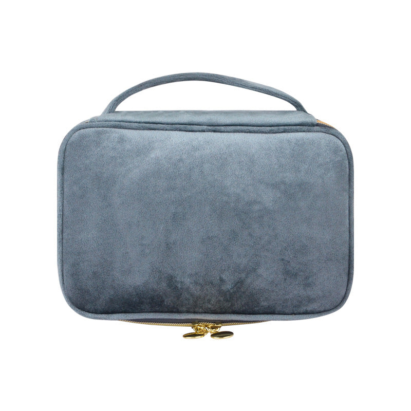 Blue gray soft travel cosmetic case with top handle and zip closure