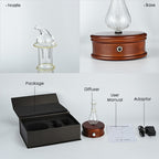 Glass aroma diffuser bottle with nozzle and dark wooden base, power inlet on back