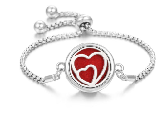 Silver-tone Ritual Aroma Bracelet with round red heart locket