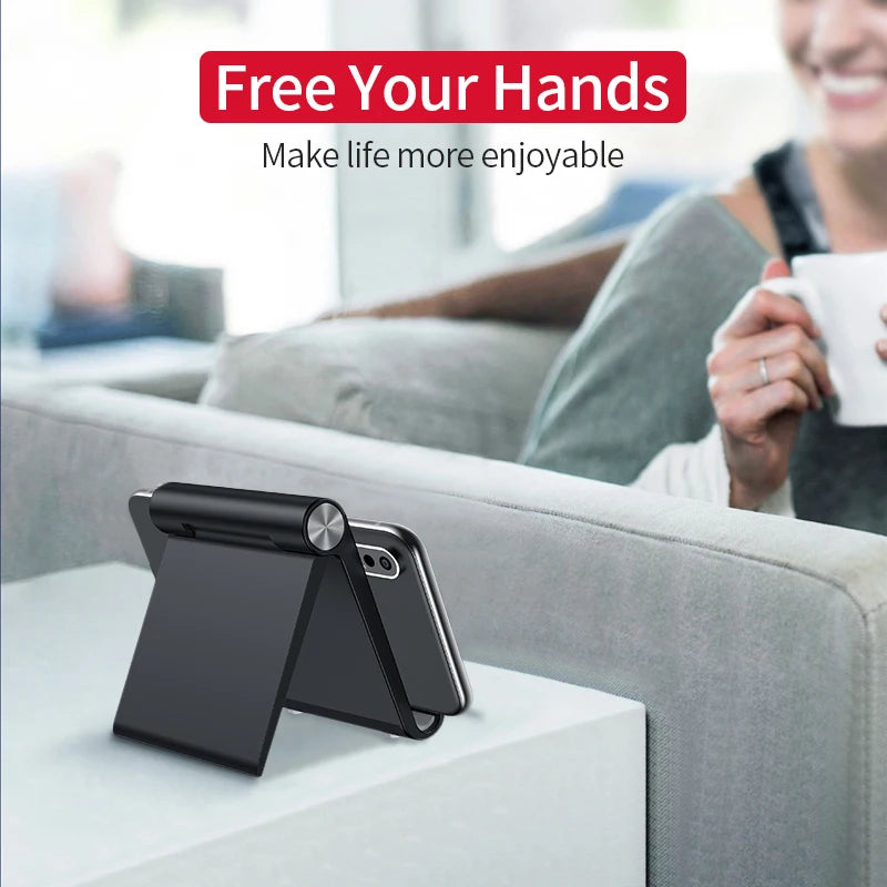 Naqsh desk phone stand in dark color, folded open with phone resting at an angle