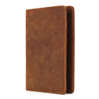 Leather passport cover with vintage patina, stitched edges, closed style in dark brown