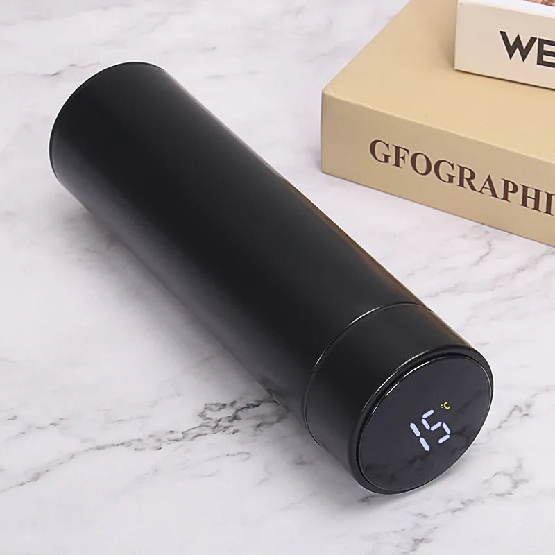 Black smart thermos with round dark LED panel showing temperature, 500ml.