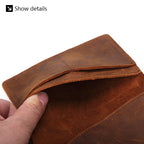Close-up of leather passport cover edge and fold, tan-brown with visible stitching