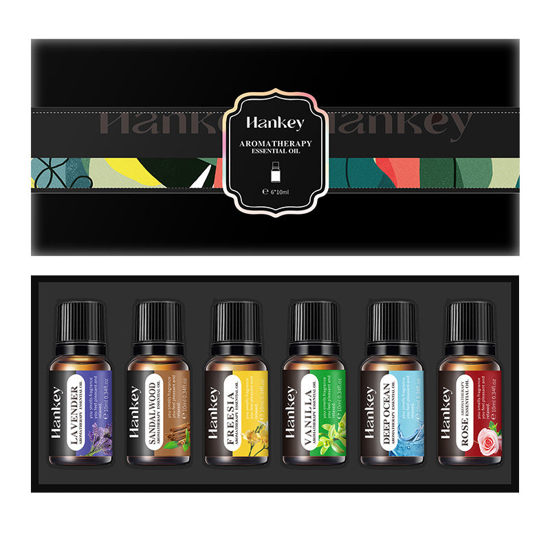 Aromatherapy essential oil set in a black gift box with six labeled bottles