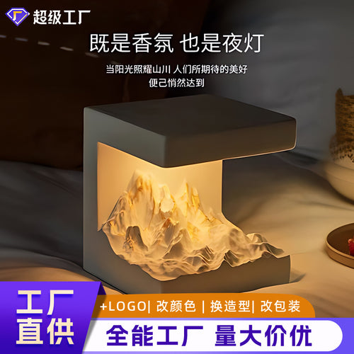 Gray cube aromatherapy lamp with warm light glow and open top cavity