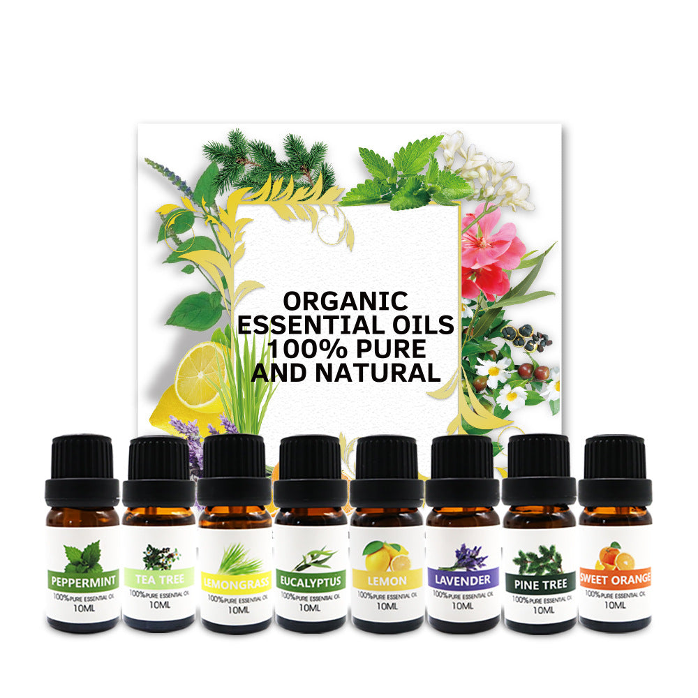 Organic essential oils gift set with 8 amber bottles; labels include peppermint and lavender.