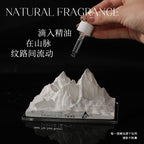 Car crystal diffuser base with white mountain stone while adding oil from dropper vial