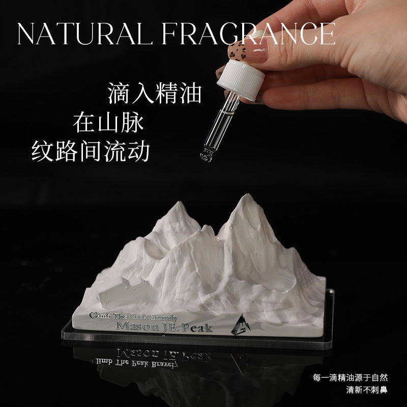 Car crystal diffuser base with white mountain stone while adding oil from dropper vial