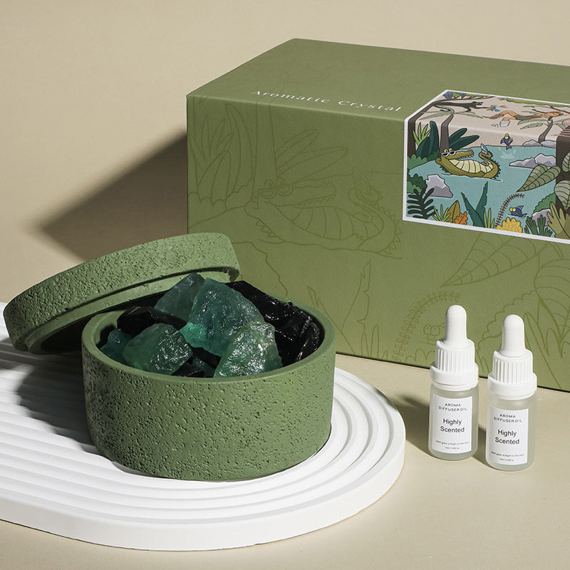 Natural stone crystal diffuser with green bowl and teal crystals, with two small bottles