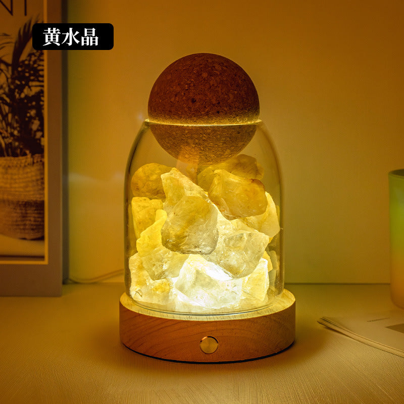 Salt stone crystal diffuser night light with yellow crystal pieces in glass dome on wood base