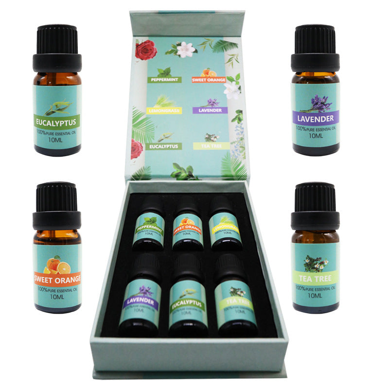 Essential oil set open box with 6 amber bottles; labels include eucalyptus, lavender, and tea tree.