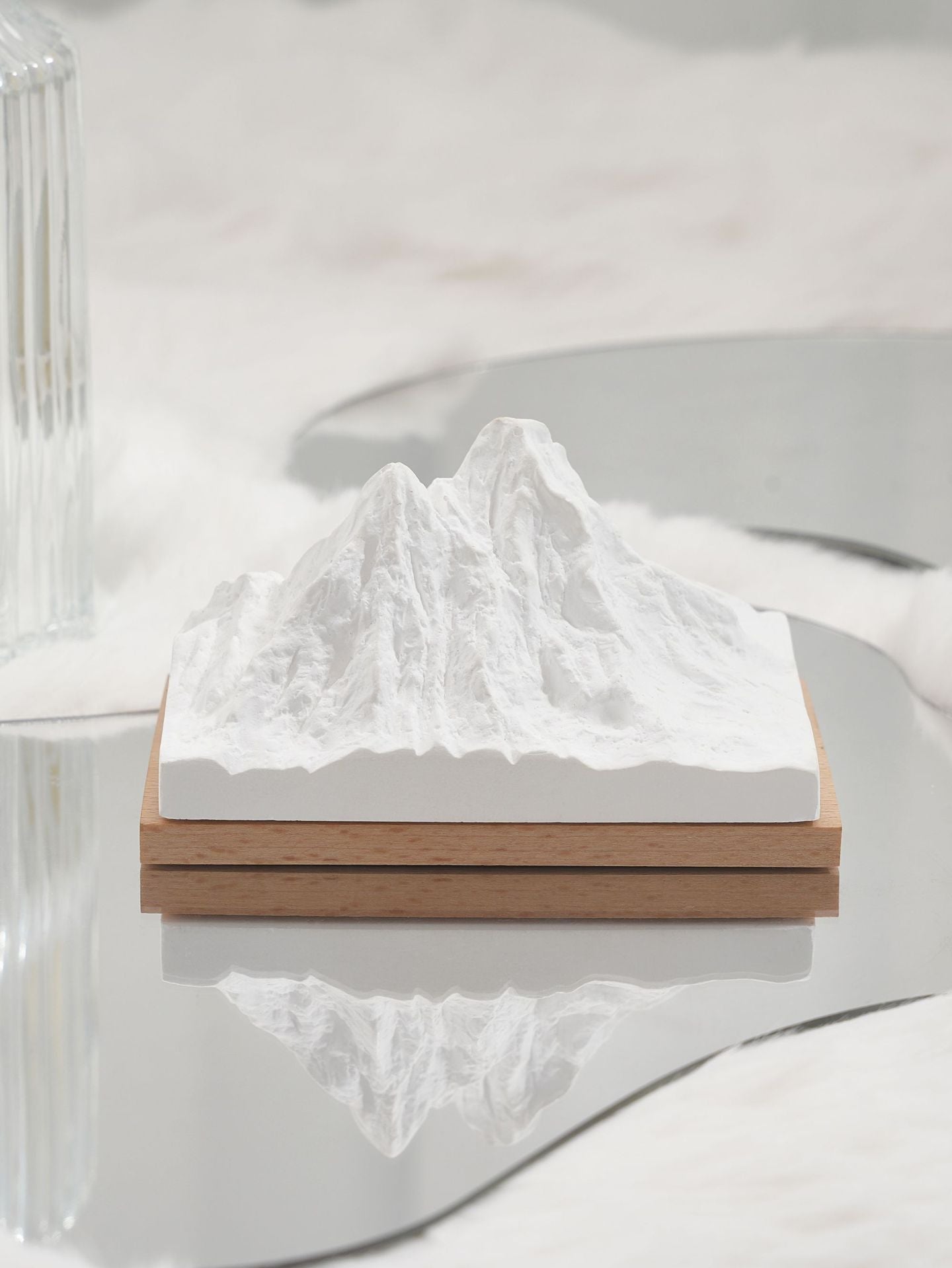 Natural stone crystal diffuser with white mountain insert on wooden base