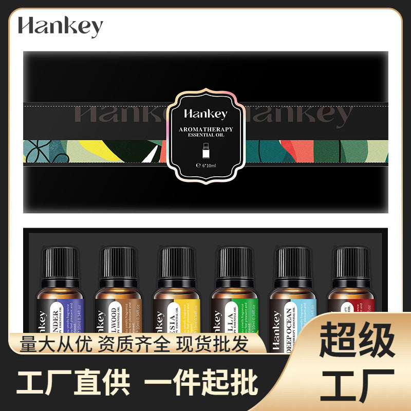Essential oil set gift box showing six small bottles with black caps