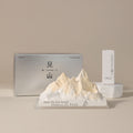 Car crystal diffuser with white mountain aroma stone on tray and two product boxes