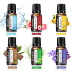 Six essential oil bottles with black caps, labeled Deep Ocean, Rose, Freesia, and more
