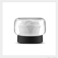 Mini rose aroma diffuser with black base and clear dome over frosted rose diffuser insert.