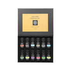 Aromatherapy essential oil set with 12 small dark bottles in a black display box
