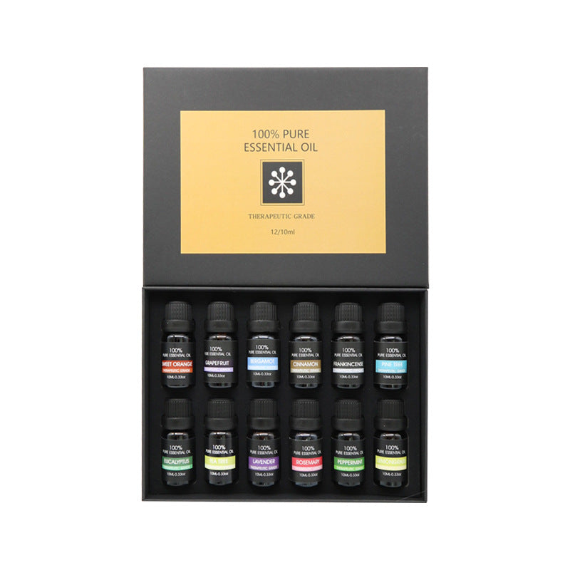Aromatherapy essential oil set with 12 small dark bottles in a black display box