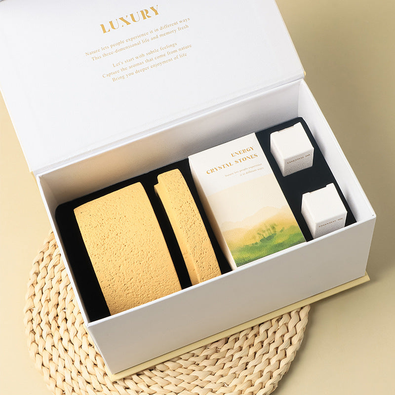 Natural stone crystal diffuser set in box with sand-colored stones and two small bottles