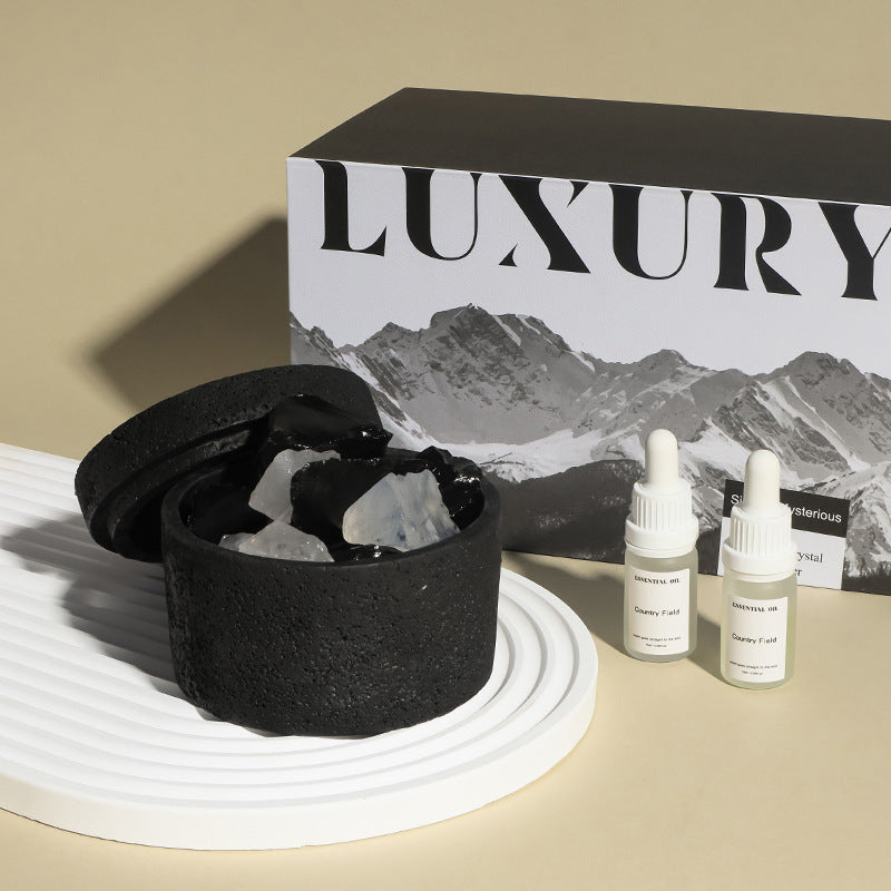 Natural stone crystal diffuser with black bowl and clear crystals, includes two bottles