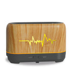 Light wood aroma diffuser with mist controls and waveform light graphic