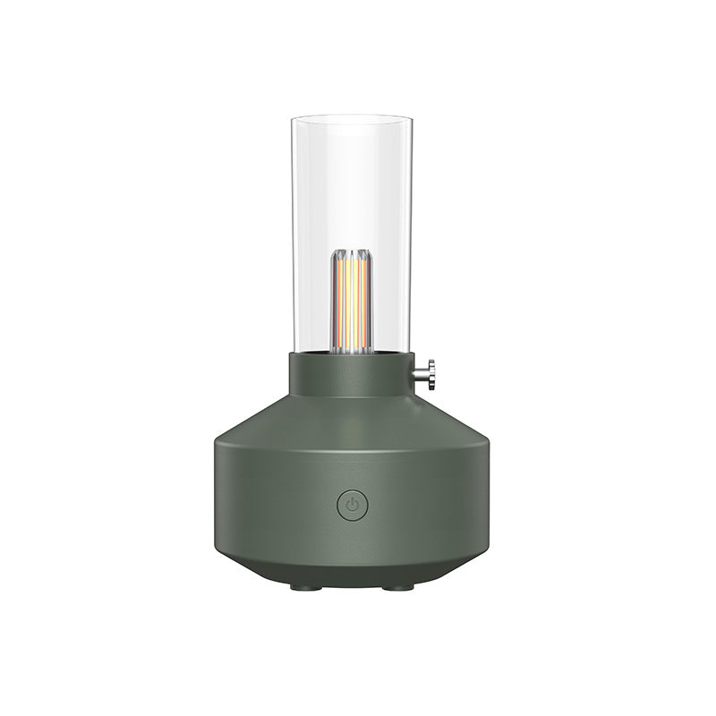 Green aroma diffuser with clear glass tube and warm glowing filament