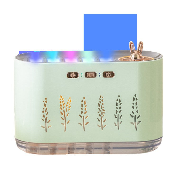 Mint green aroma diffuser with blue LED flame ring, bunny topper, leaf silhouette front