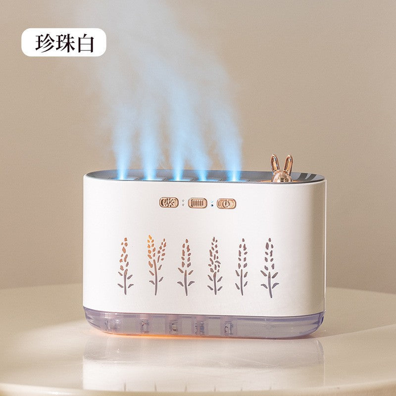 White aroma diffuser with blue LED flame ring, bunny topper, leaf cutout front panel