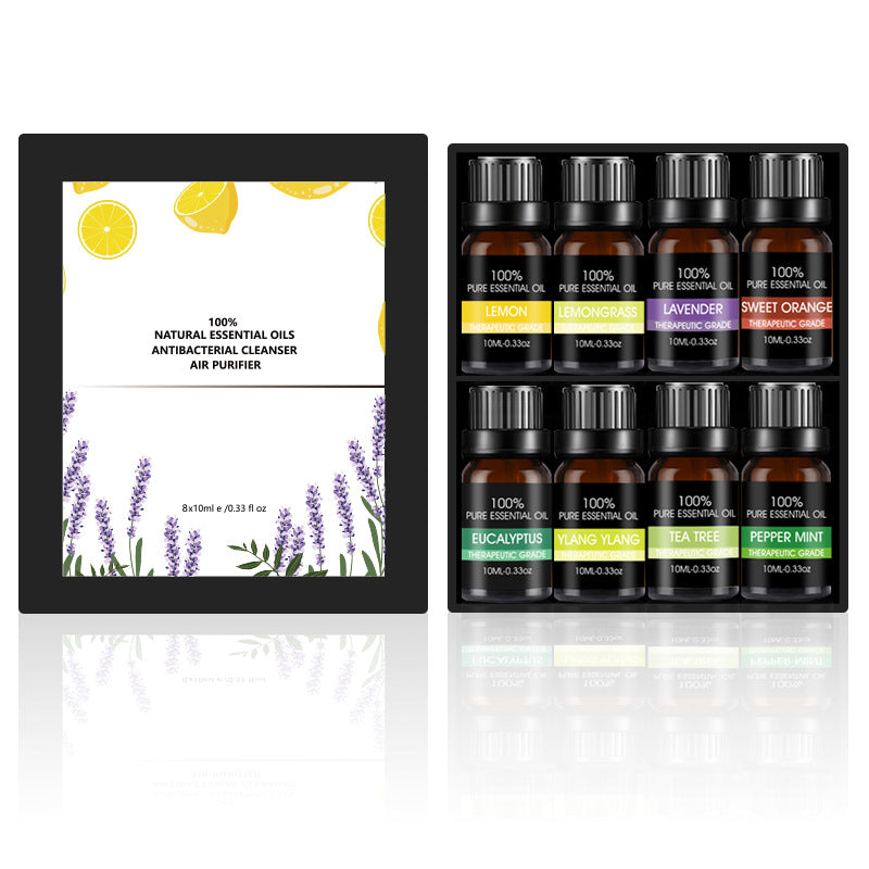 Essential oil gift box with multiple amber bottles; labels include lemon, eucalyptus, and tea tree.