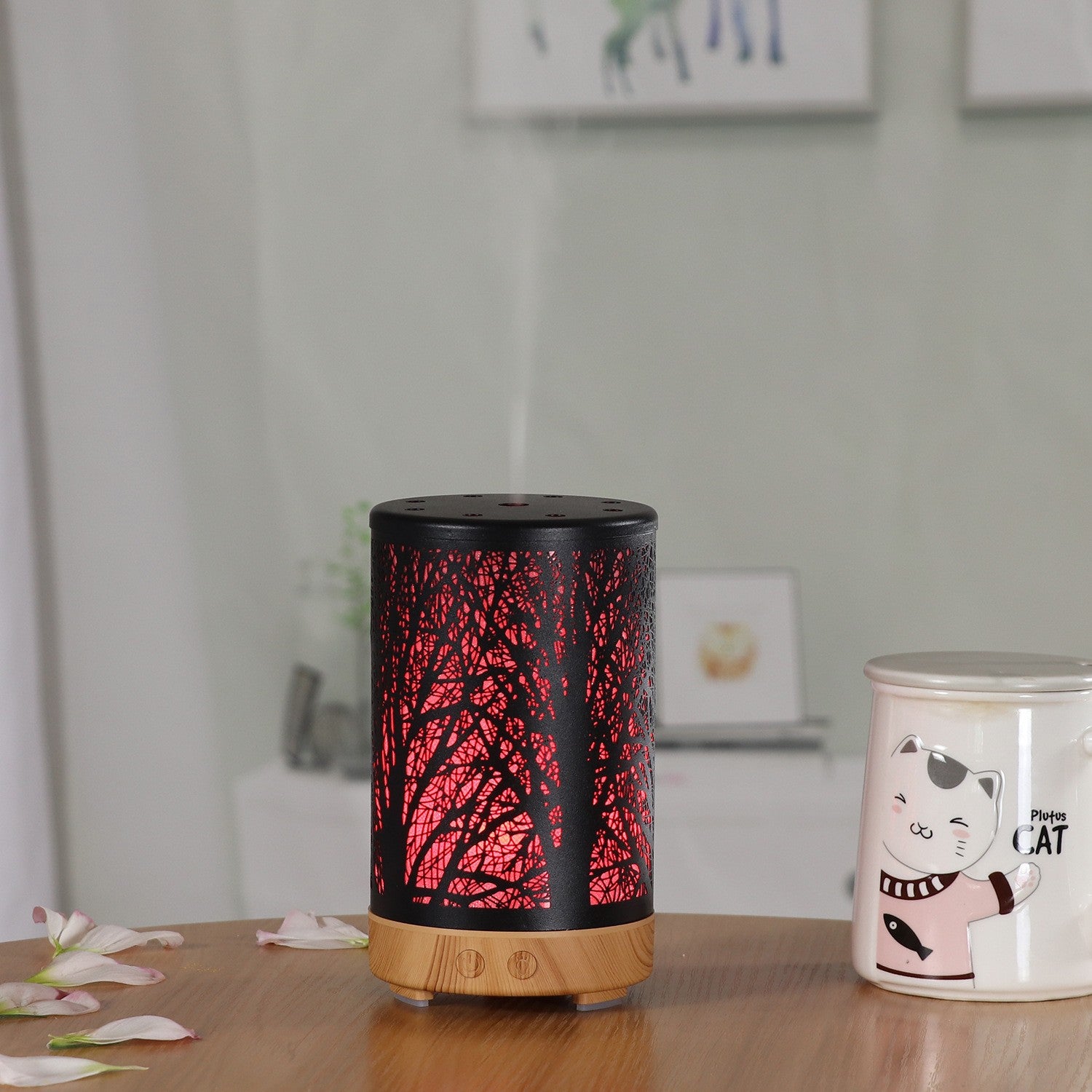 Mini aroma diffuser with light wood base, red forest glow, top vent holes