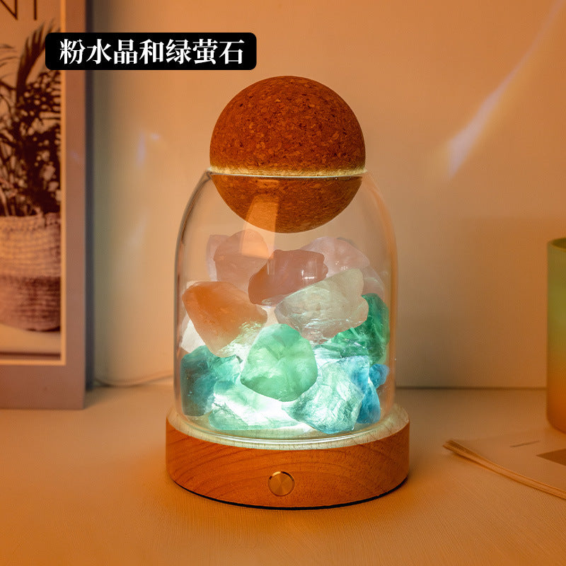 Crystal diffuser night light with mixed orange and mint crystal chunks on wooden base