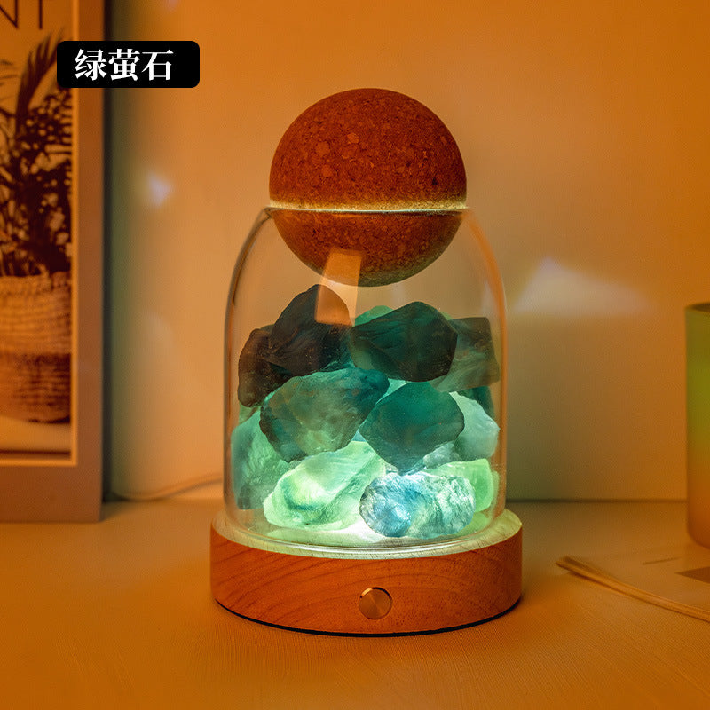 Salt stone crystal diffuser night light with green crystal pieces in glass dome on wood base