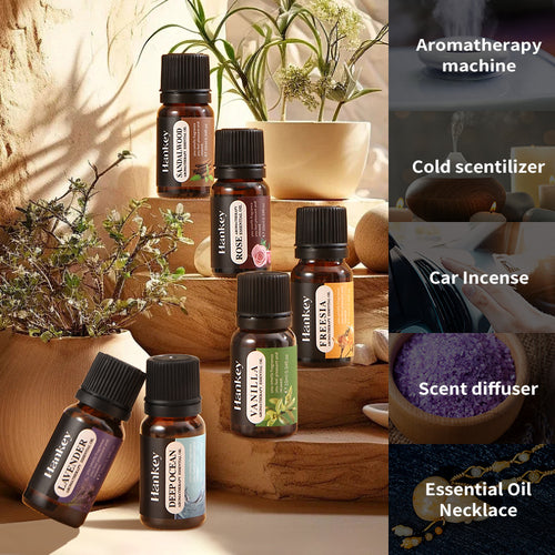 Aromatherapy essential oil bottles on a wooden surface with herbs and flowers nearby