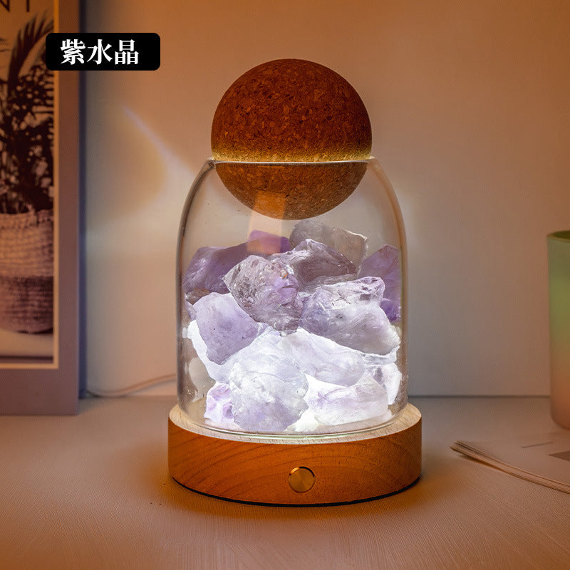 Salt stone crystal diffuser night light with purple crystals in clear glass dome on wood base