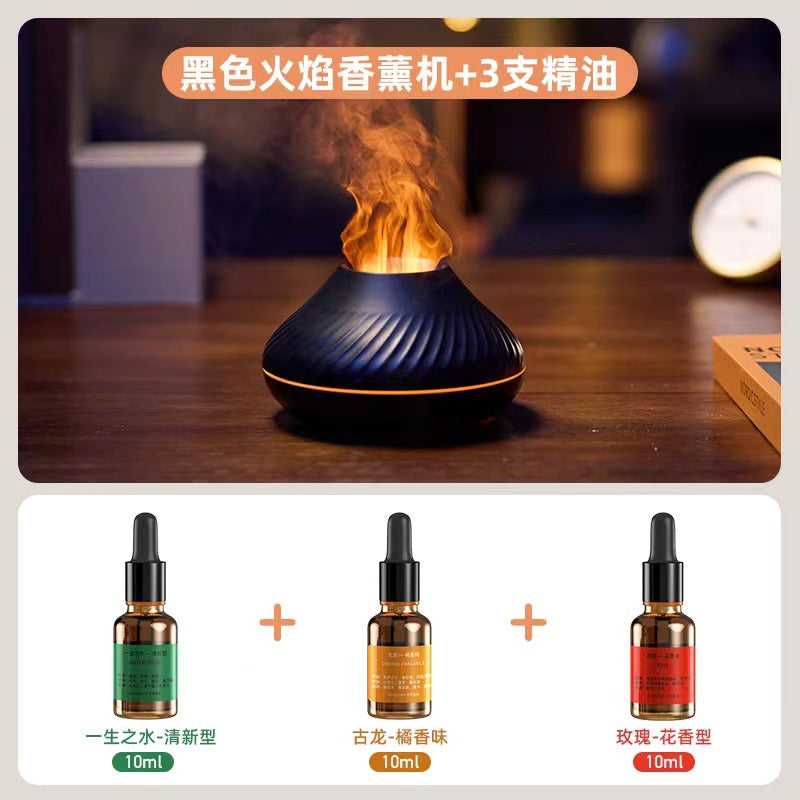 Black flame aroma diffuser with orange flame effect and three essential oil bottles