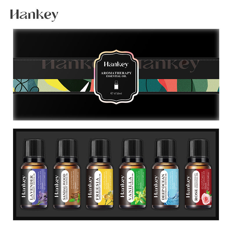 Essential oil set gift box displaying six labeled bottles with black caps