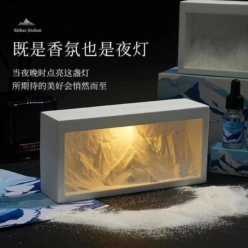 Rectangular crystal diffuser with warm light mountain-style core in white housing