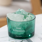 Green glass oil diffuser bowl filled with pale mint and clear crystal pieces