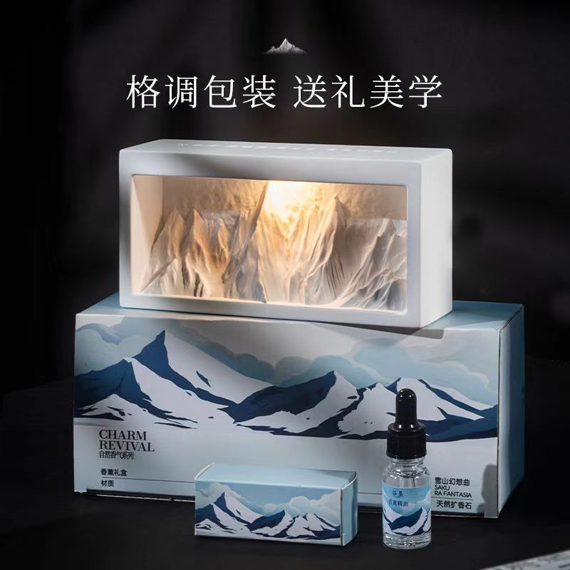 Crystal diffuser gift set with lit mountain-style unit, gift box and essential oil bottle