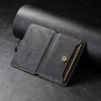 Dark leather MagSafe phone wallet with card slots and magnetic snap closure