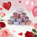 Stack of patterned tin candles with ornate mandala designs