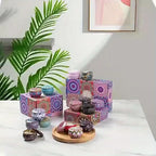 Set of 4 scented candle tins with colorful mandala-pattern lids