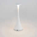 Pearl white cordless mushroom touch table lamp with slim tapered body and round top diffuser.