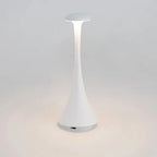 Pearl white cordless mushroom touch table lamp with slim tapered body and round top diffuser.