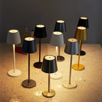 Wireless touch table lamps in mixed finishes: black, white, and gold with round bases