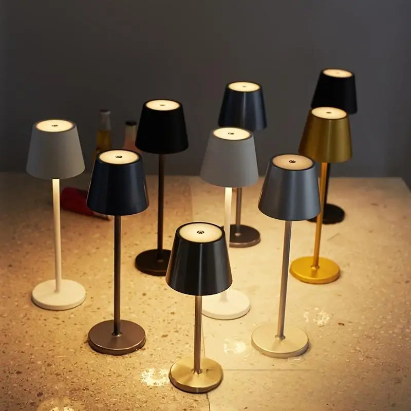 Wireless touch table lamps in mixed finishes: black, white, and gold with round bases