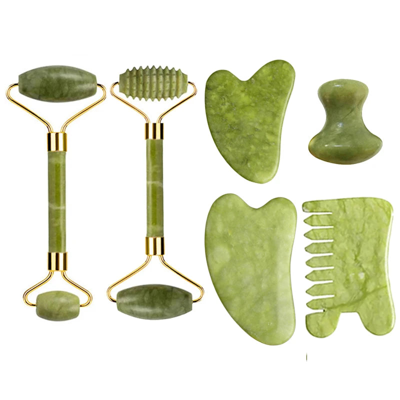 Green jade tools bundle: two rollers, a heart gua sha, and flat comb gua sha pieces