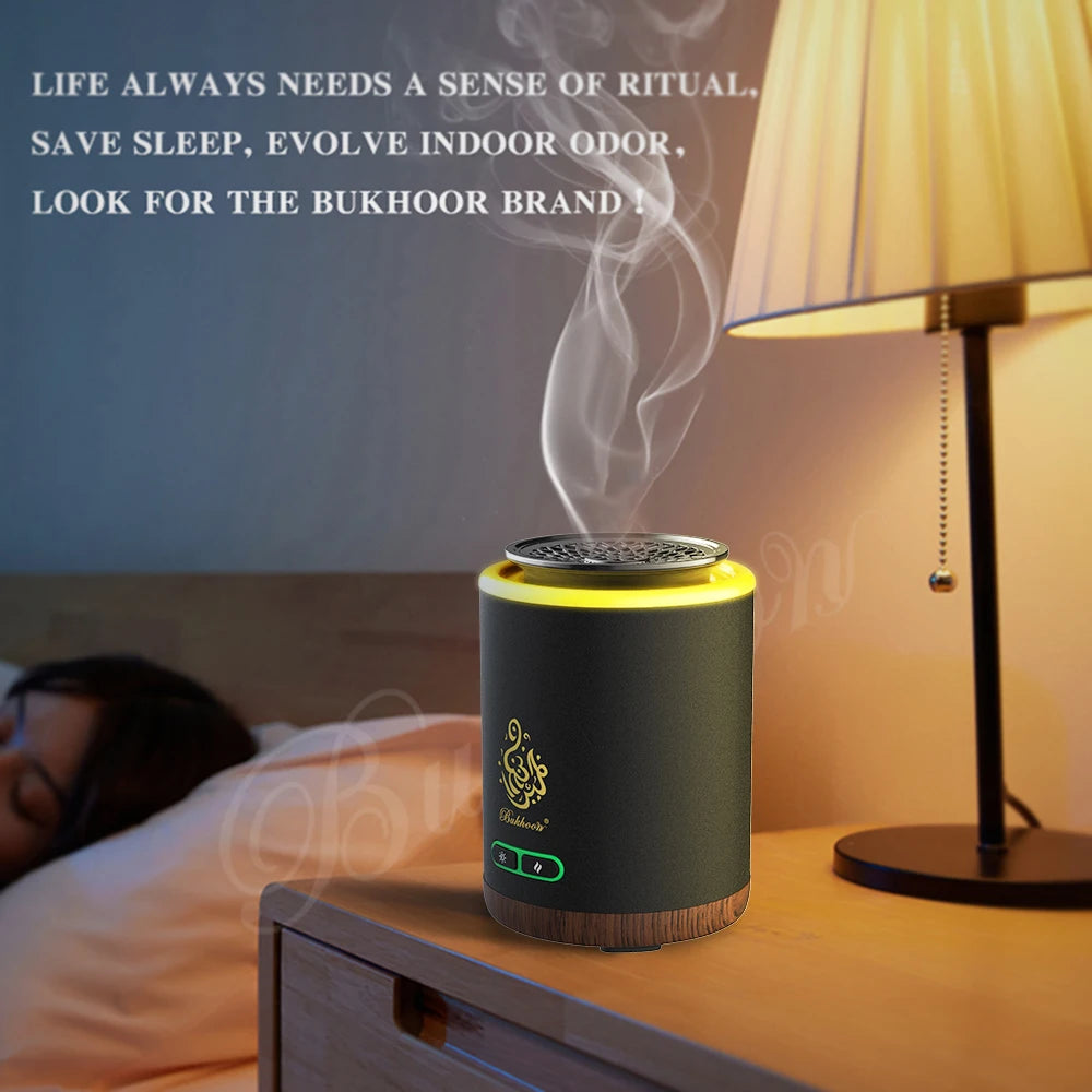 Sage electric bakhoor burner on bedside table with smoke rising